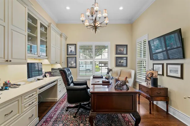 a living room with fireplace furniture and a chandelier
