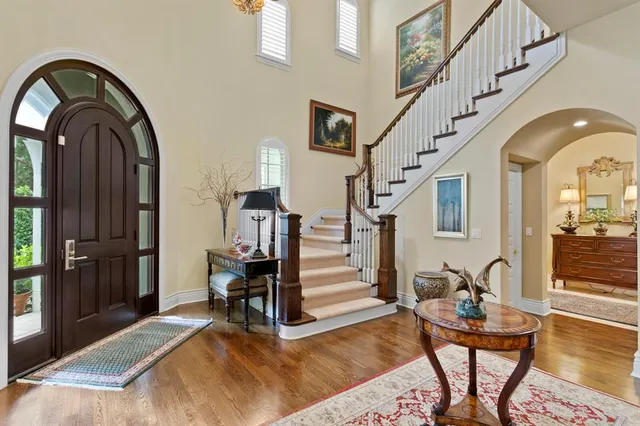 a view of entryway livingroom and hall with wooden floor