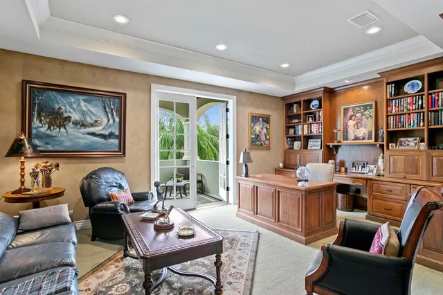 a living room with furniture a rug and a window