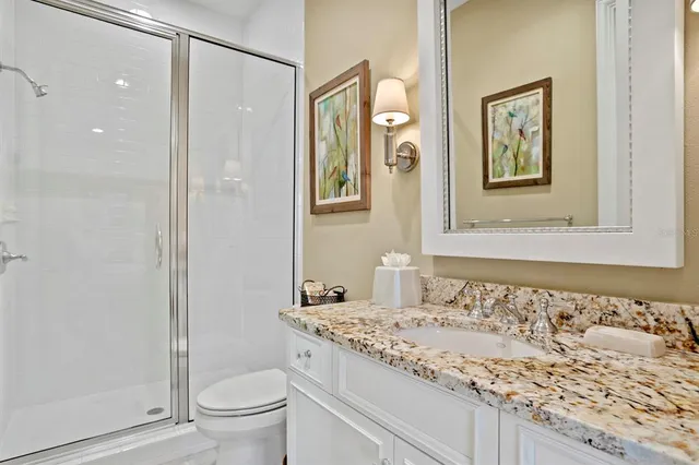 a spacious bedroom with two beds and a desk