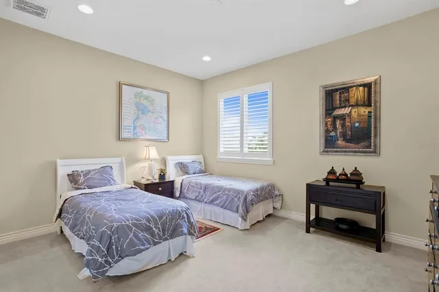 a bathroom with a granite countertop sink a toilet a mirror and shower