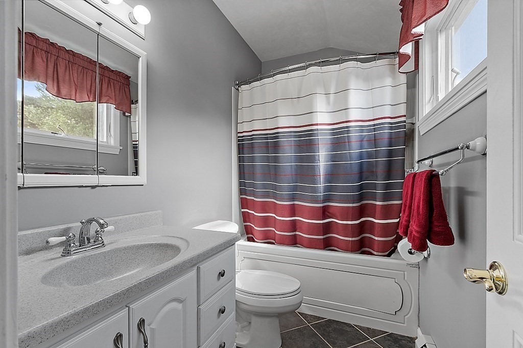 6 Wildes Road Chelmsford, MA 01824 - Photo 24 of 42 a bathroom with a sink and mirror with toilet