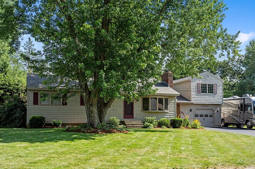 6 Wildes Road Chelmsford, MA 01824 - Photo 3 of 42 a front view of a house with a yard