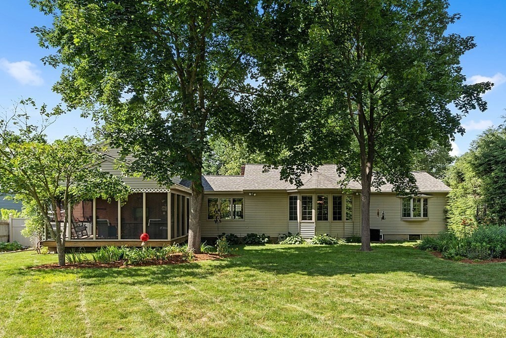 6 Wildes Road Chelmsford, MA 01824 - Photo 36 of 42 a front view of a house with a yard and porch