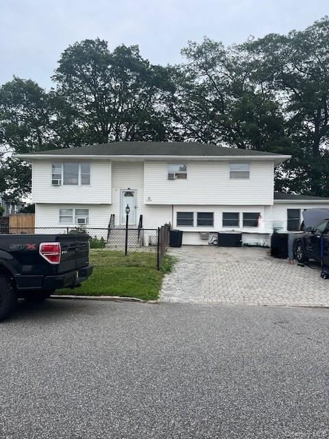 226 14th Avenue West Babylon, NY 11704 - Photo 1 of 27 a view of a car park in front of house