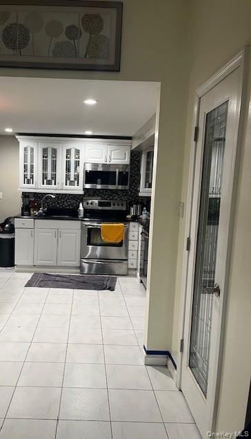 226 14th Avenue West Babylon, NY 11704 - Photo 13 of 27 a view of a refrigerator in kitchen and a sink