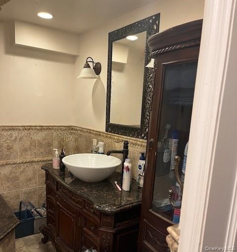 226 14th Avenue West Babylon, NY 11704 - Photo 19 of 27 a bathroom with a granite countertop sink a mirror and a toilet
