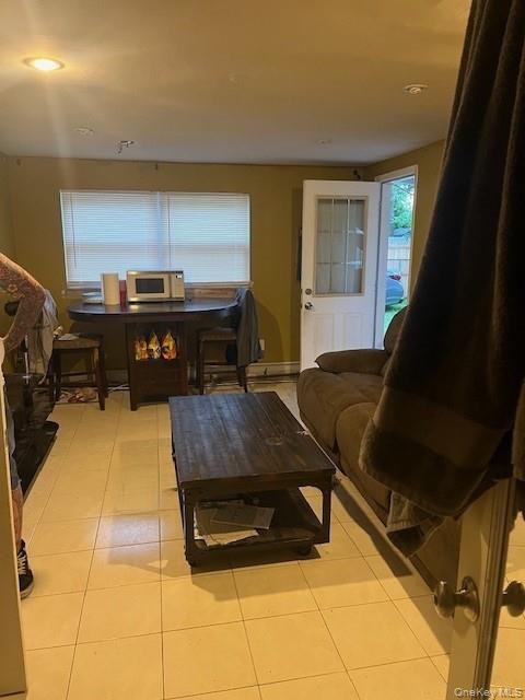 226 14th Avenue West Babylon, NY 11704 - Photo 20 of 27 a living room with a couch