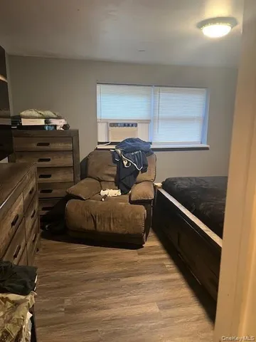 a bedroom with a bed and a ceiling fan