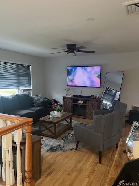 226 14th Avenue West Babylon, NY 11704 - Photo 3 of 27 a living room with furniture and a flat screen tv