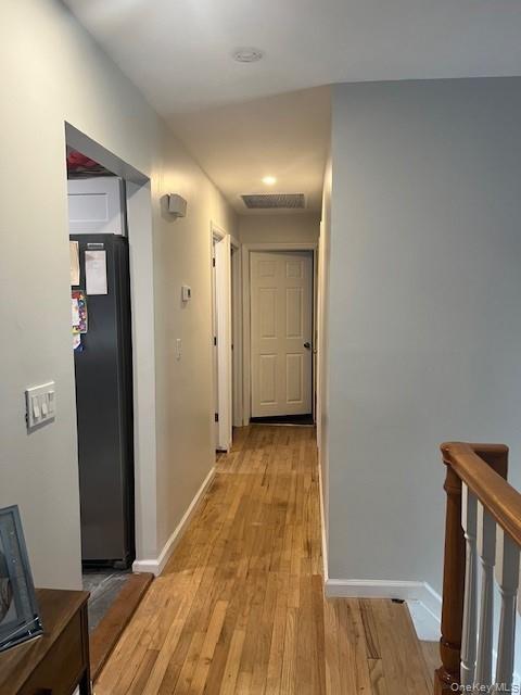 226 14th Avenue West Babylon, NY 11704 - Photo 6 of 27 a view of a hallway with wooden floor and staircase