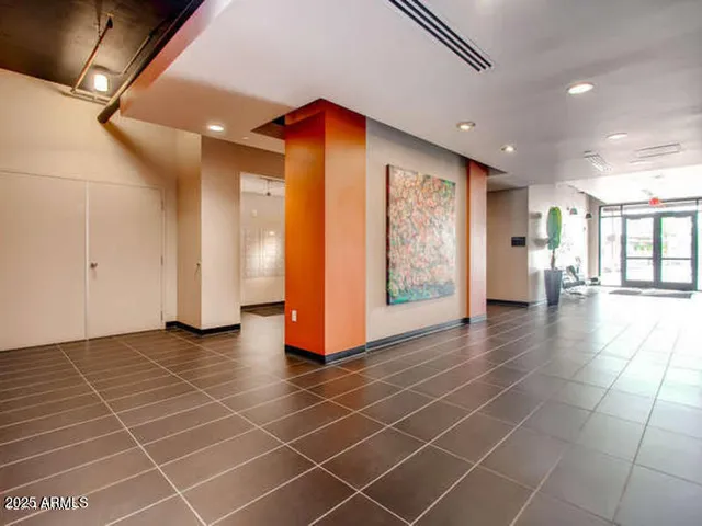 a view of an entryway with wooden floor