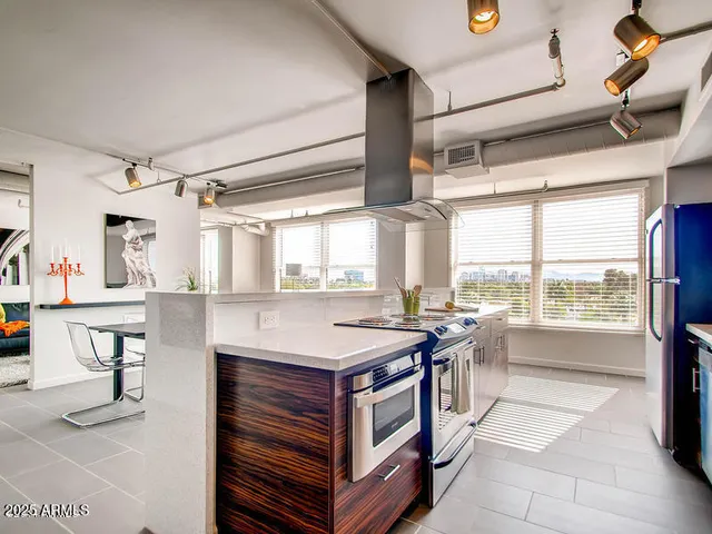 a kitchen that has a lot of cabinets in it