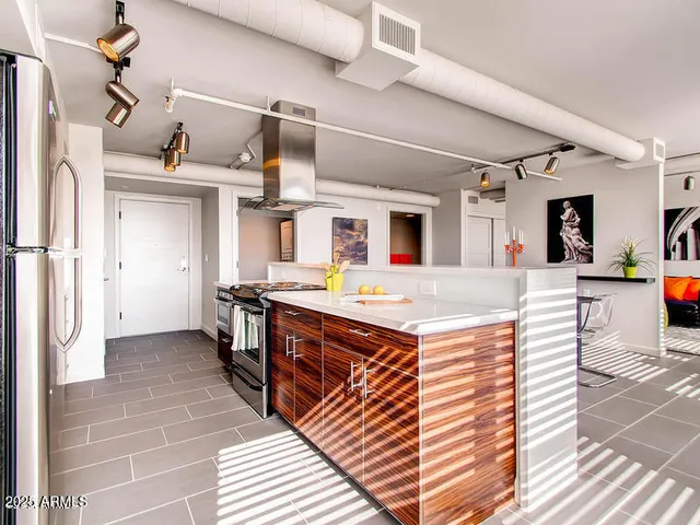 a kitchen with stainless steel appliances granite countertop a sink and cabinets