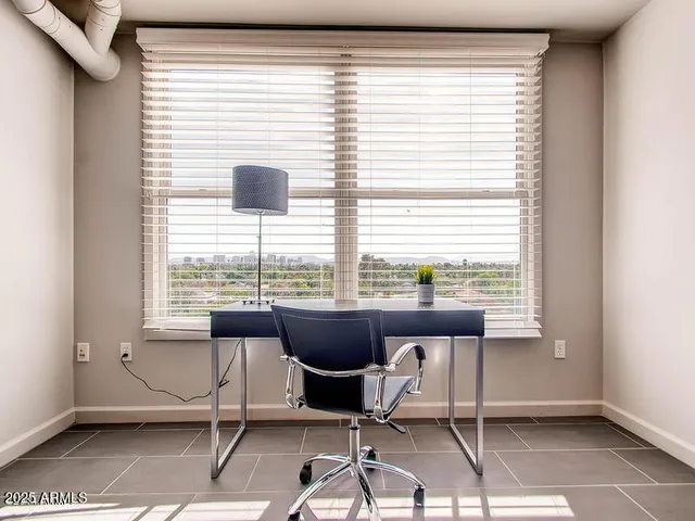 a view of a room with a table and chair