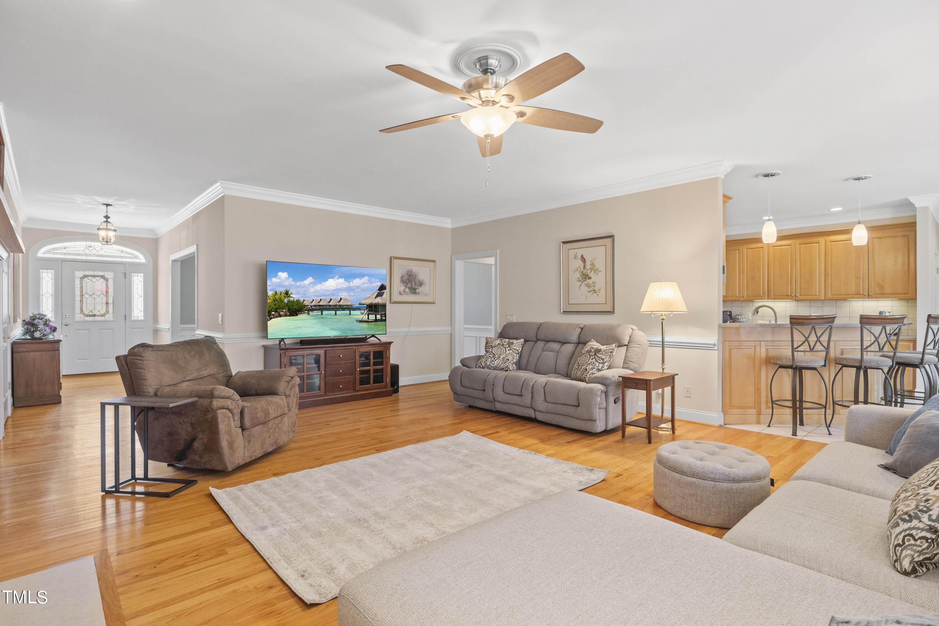 5504 Yates Mill Pond Road Raleigh, NC 27606 - Photo 10 of 56 a living room with furniture and a flat screen tv