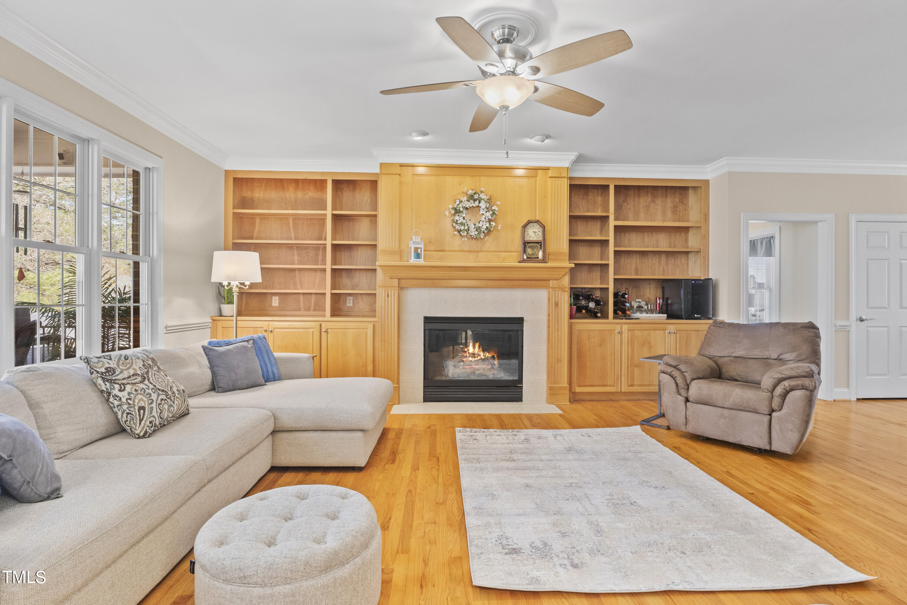 5504 Yates Mill Pond Road Raleigh, NC 27606 - Photo 12 of 56 a living room with furniture fireplace and a large window