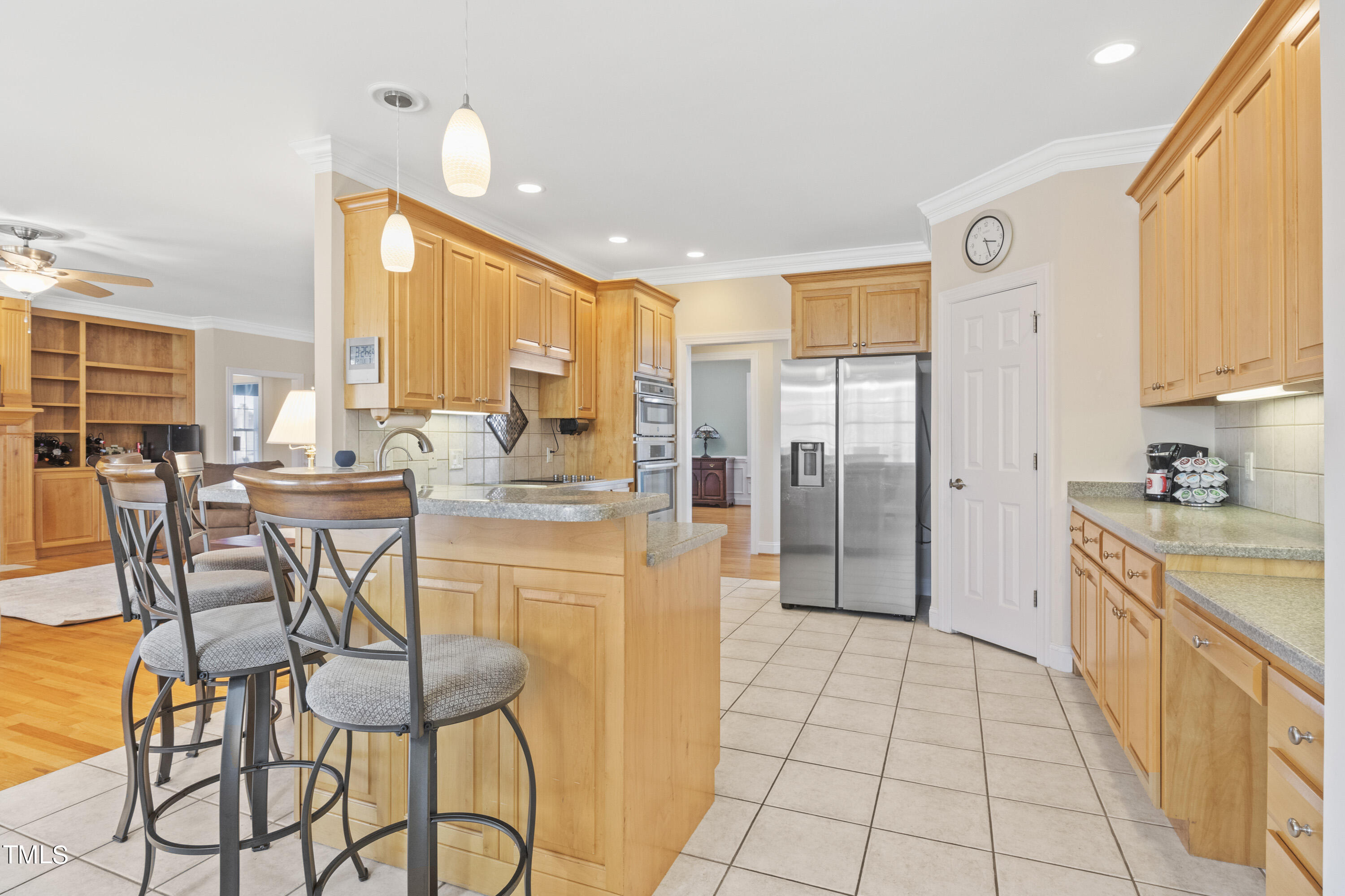 5504 Yates Mill Pond Road Raleigh, NC 27606 - Photo 13 of 56 a large kitchen with a table and chairs