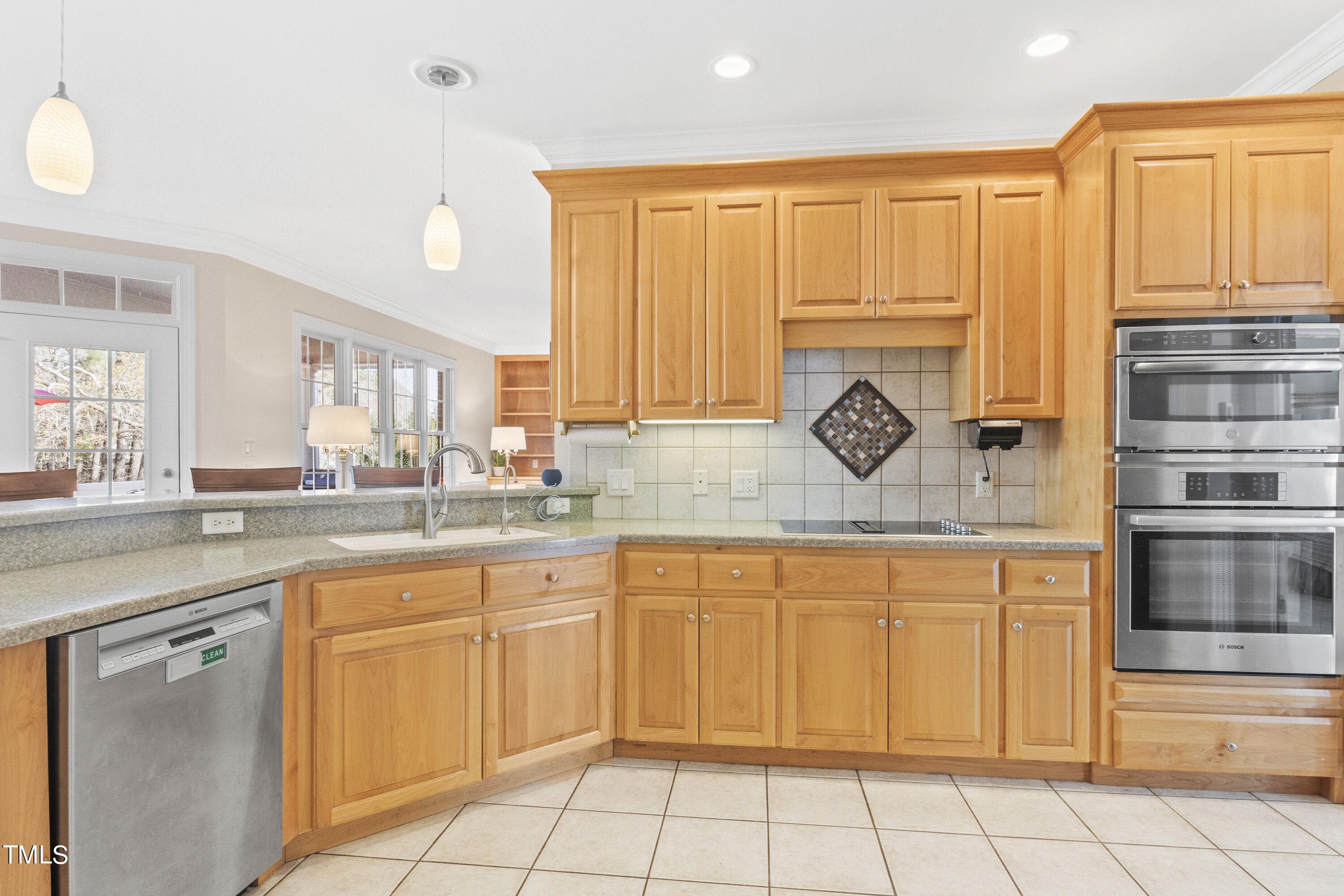 5504 Yates Mill Pond Road Raleigh, NC 27606 - Photo 15 of 56 a view of a kitchen with sink and large window