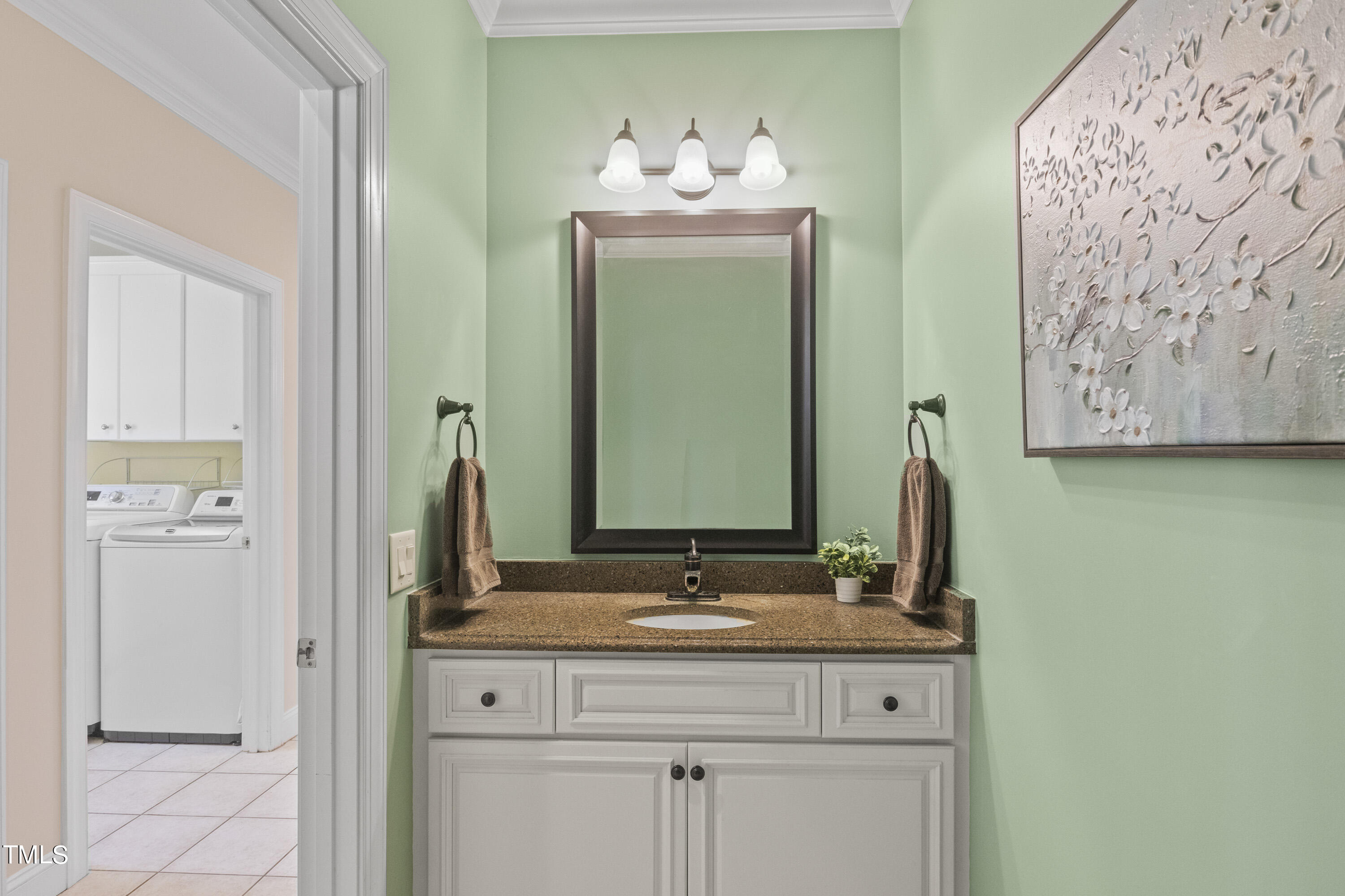 5504 Yates Mill Pond Road Raleigh, NC 27606 - Photo 18 of 56 a bathroom with a sink and a mirror