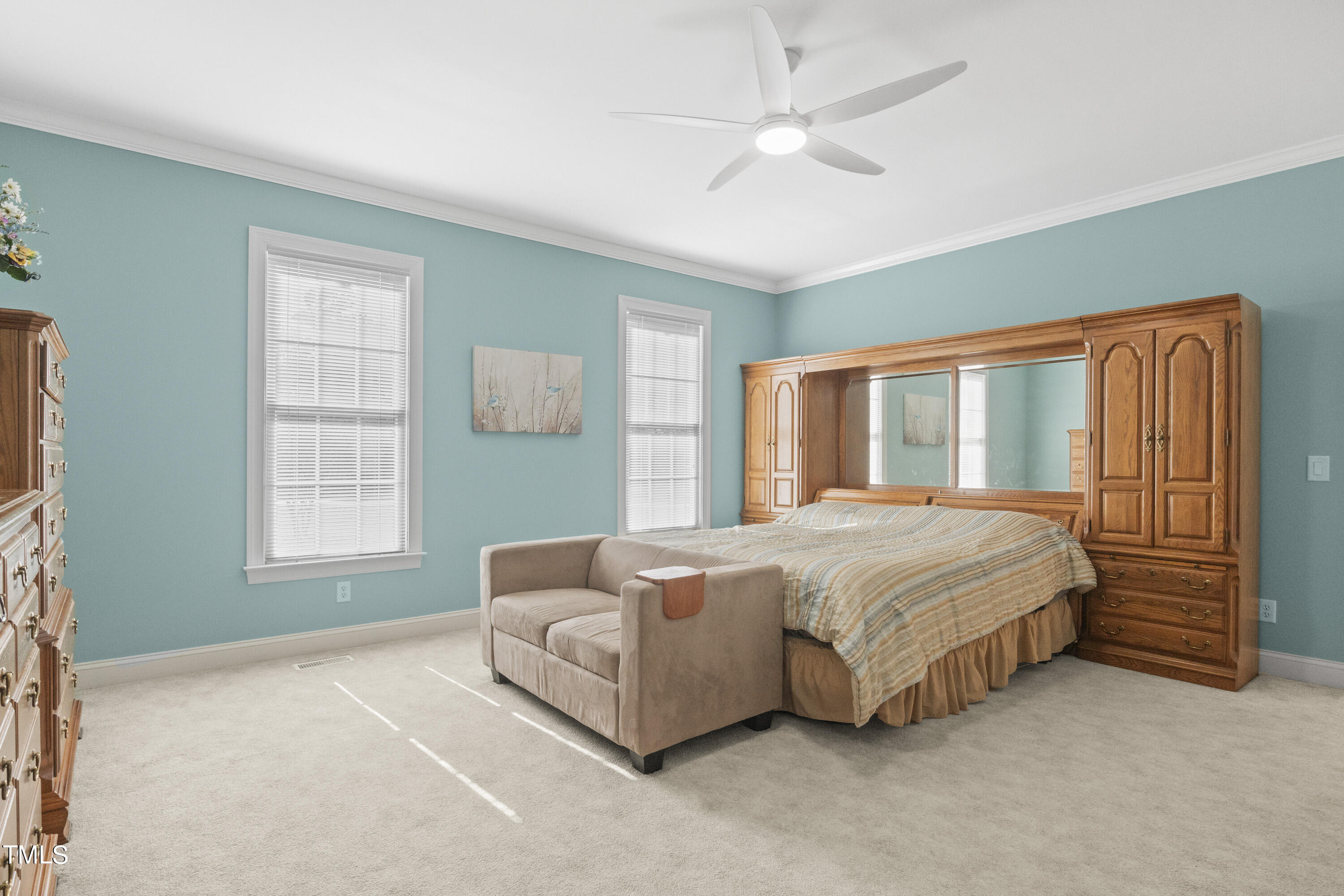 5504 Yates Mill Pond Road Raleigh, NC 27606 - Photo 19 of 56 a spacious bedroom with a bed and a window