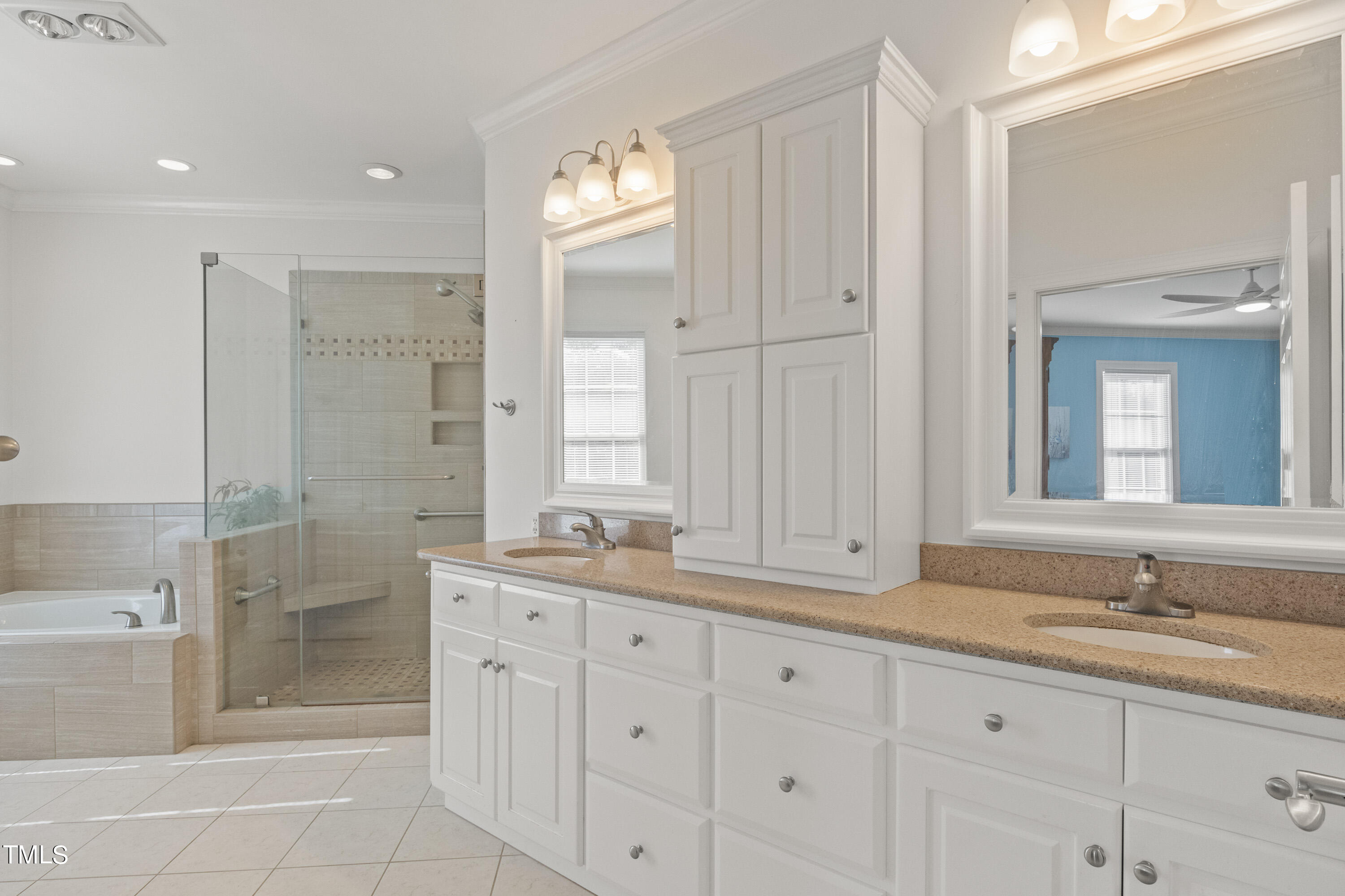 5504 Yates Mill Pond Road Raleigh, NC 27606 - Photo 21 of 56 a bathroom with a granite countertop sink mirror and double