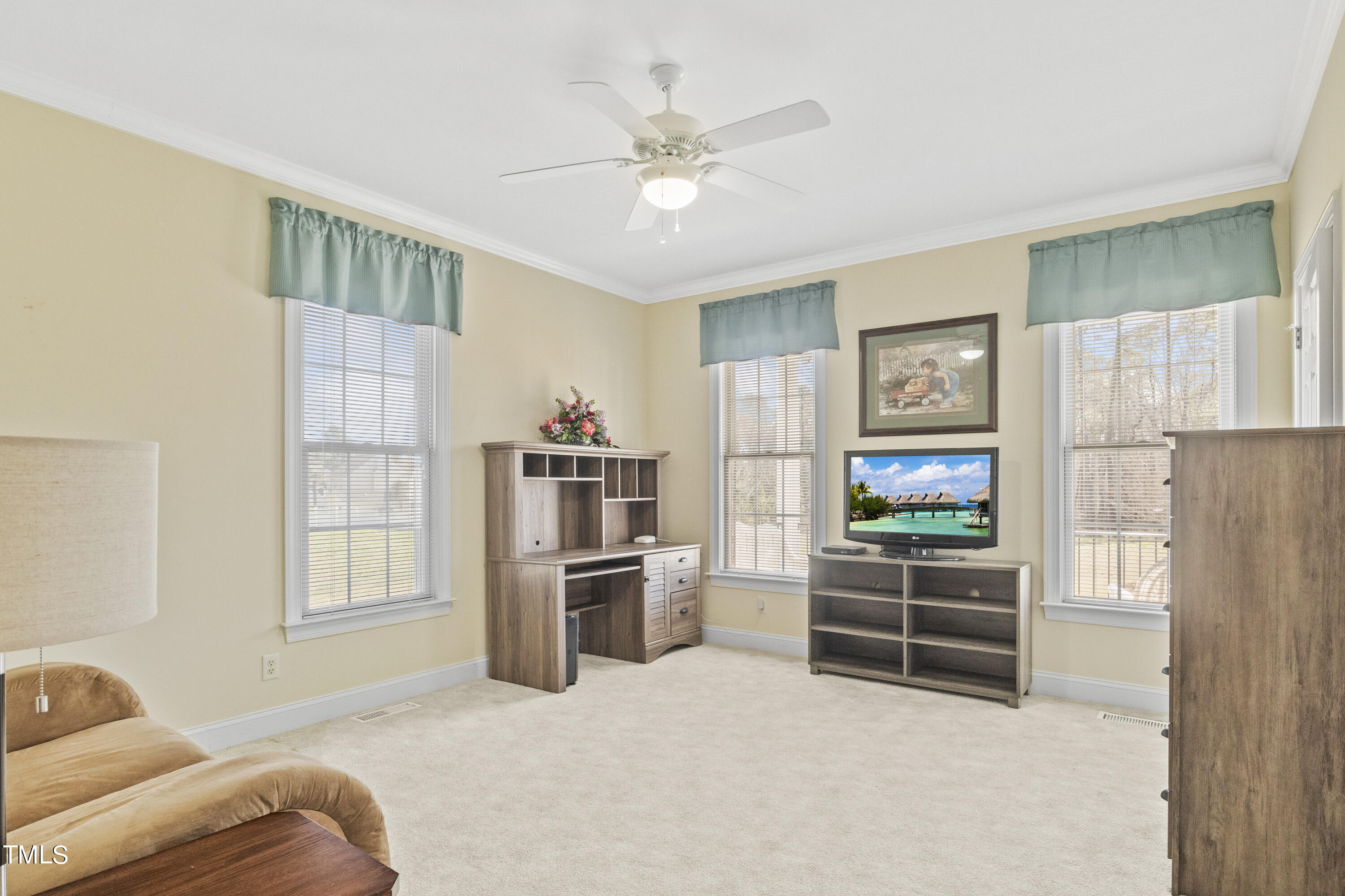 5504 Yates Mill Pond Road Raleigh, NC 27606 - Photo 26 of 56 a living room with furniture and a flat screen tv