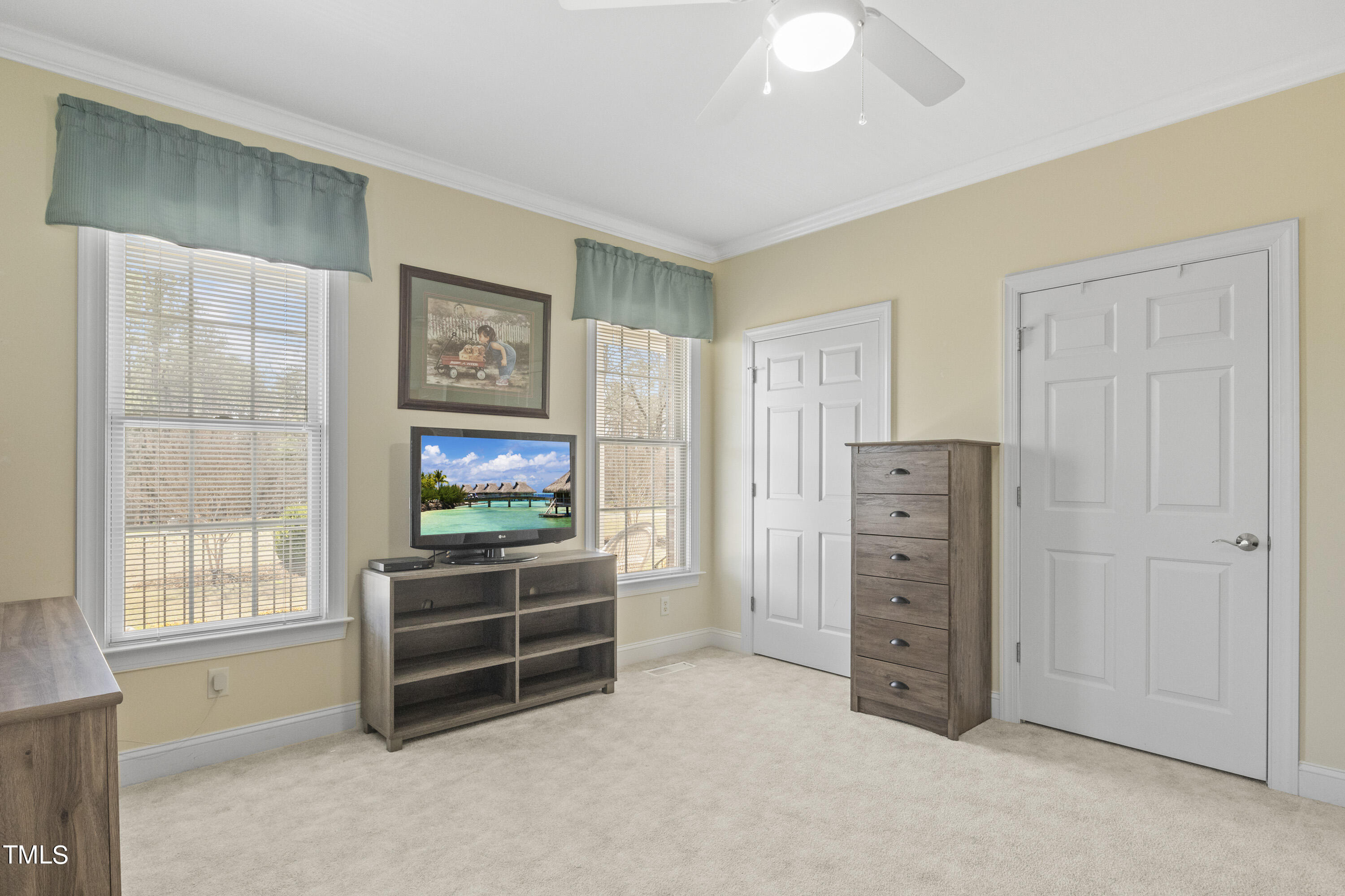 5504 Yates Mill Pond Road Raleigh, NC 27606 - Photo 27 of 56 a living room with furniture and a flat screen tv