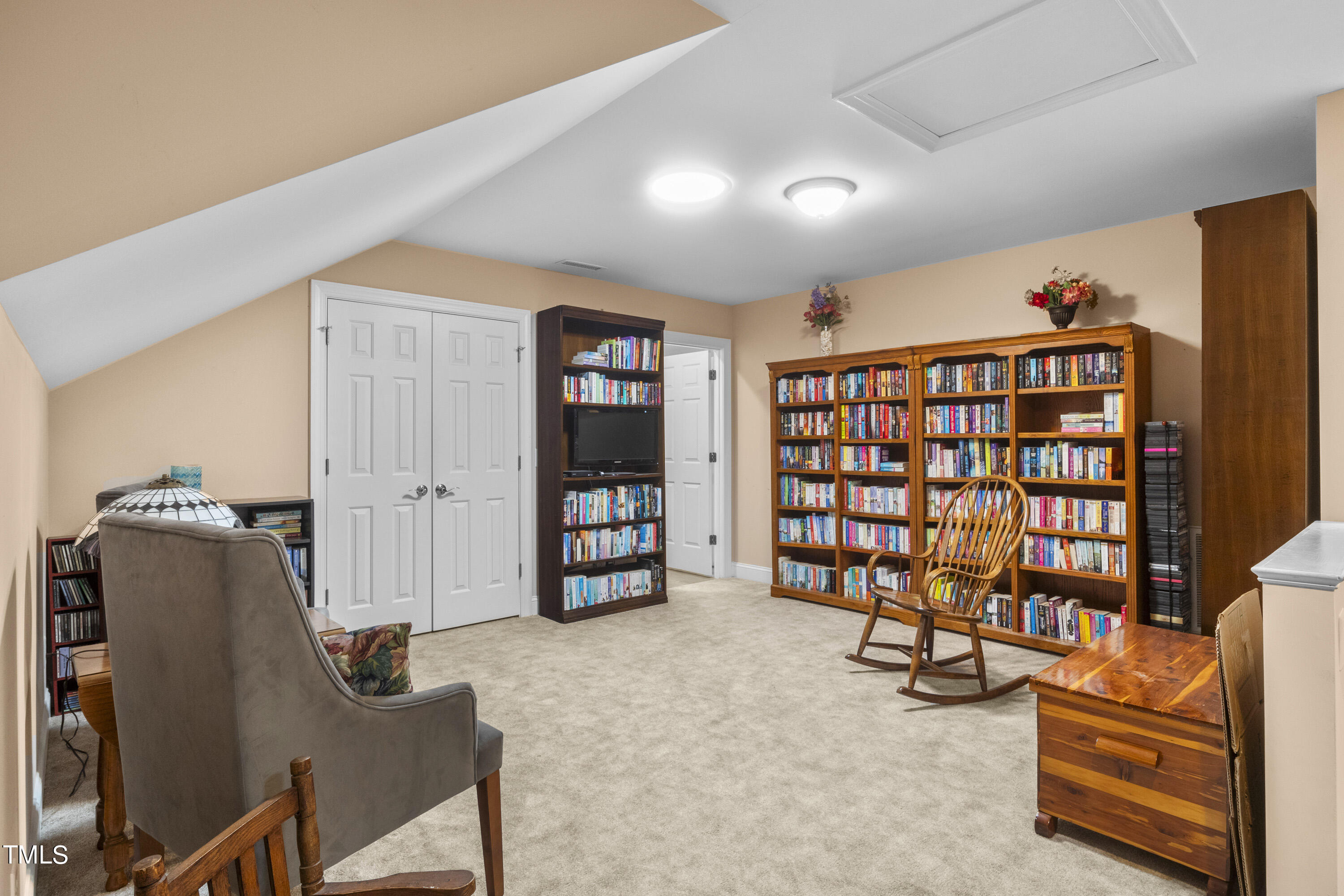 5504 Yates Mill Pond Road Raleigh, NC 27606 - Photo 31 of 56 a living room with furniture and gym equipment