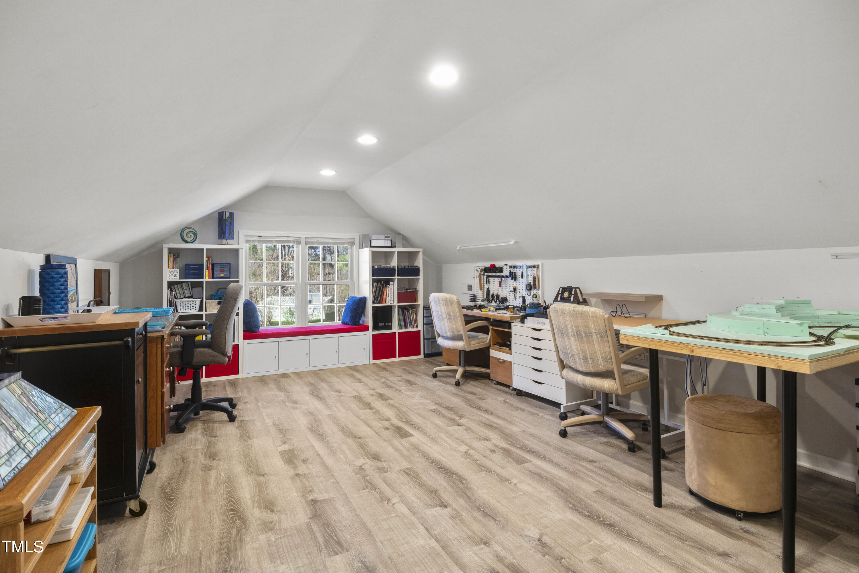5504 Yates Mill Pond Road Raleigh, NC 27606 - Photo 32 of 56 a living room with furniture and a wooden floor