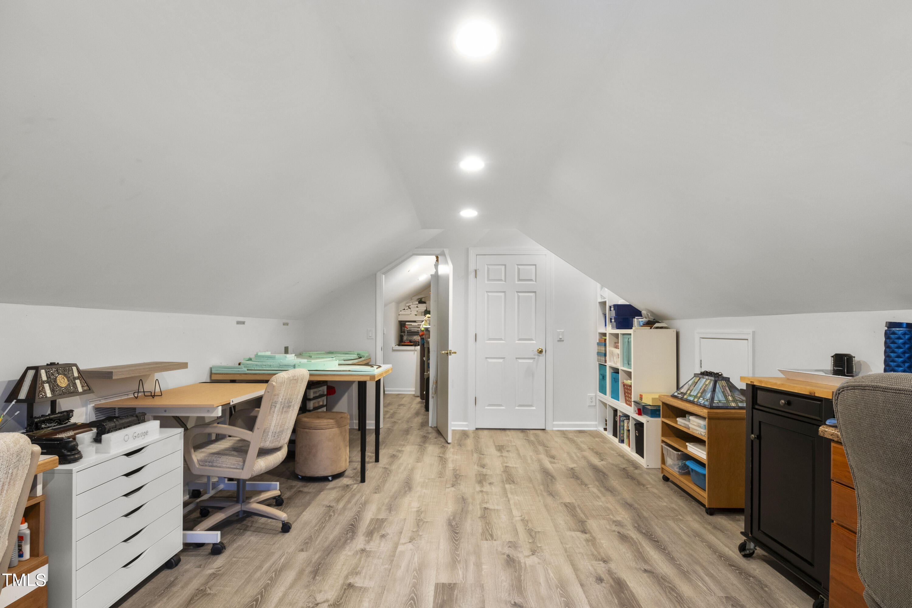 5504 Yates Mill Pond Road Raleigh, NC 27606 - Photo 33 of 56 a view of a workspace with furniture and wooden floor