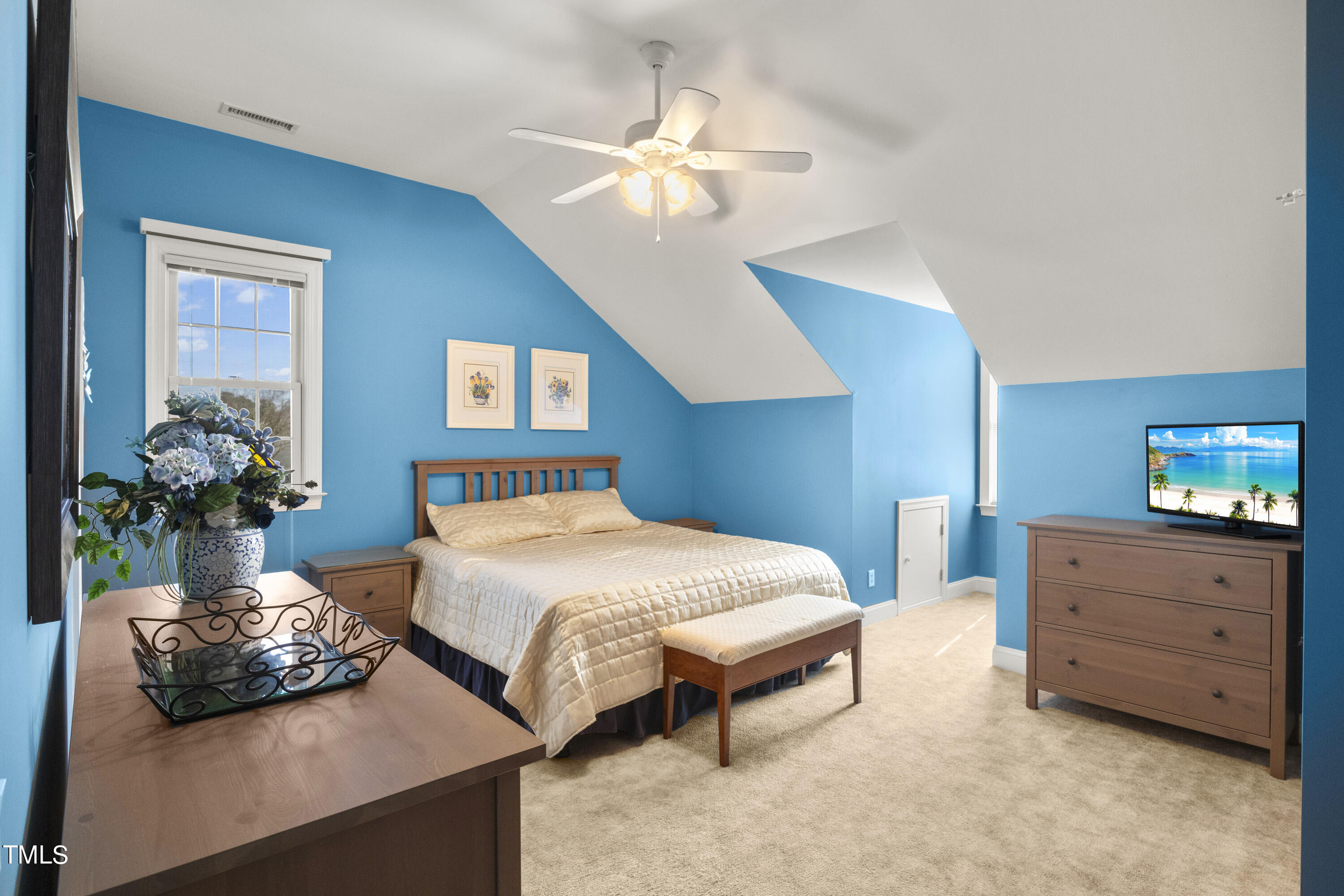 5504 Yates Mill Pond Road Raleigh, NC 27606 - Photo 34 of 56 a bedroom with a bed and ceiling fan