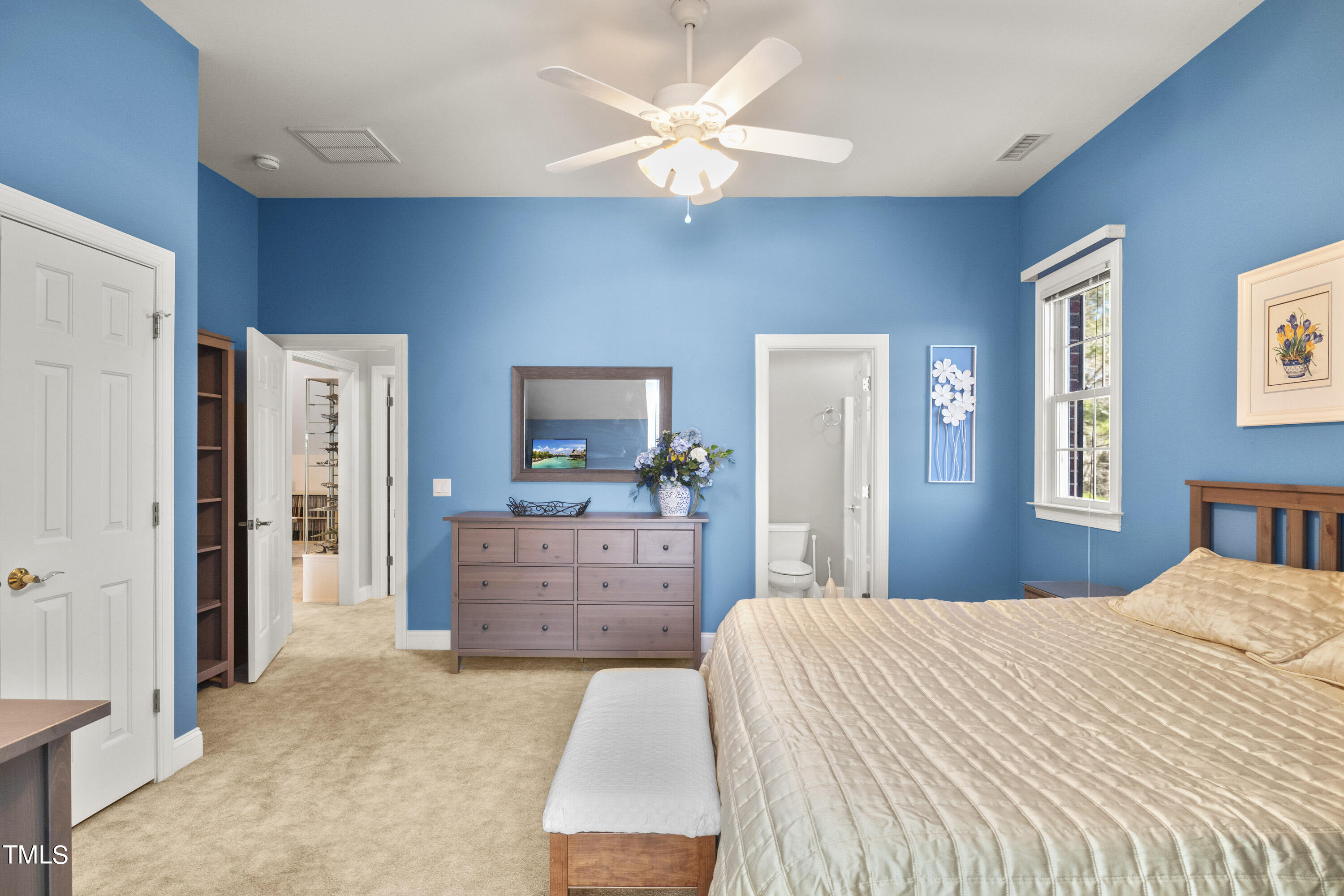 5504 Yates Mill Pond Road Raleigh, NC 27606 - Photo 35 of 56 a bedroom with a bed and a dresser
