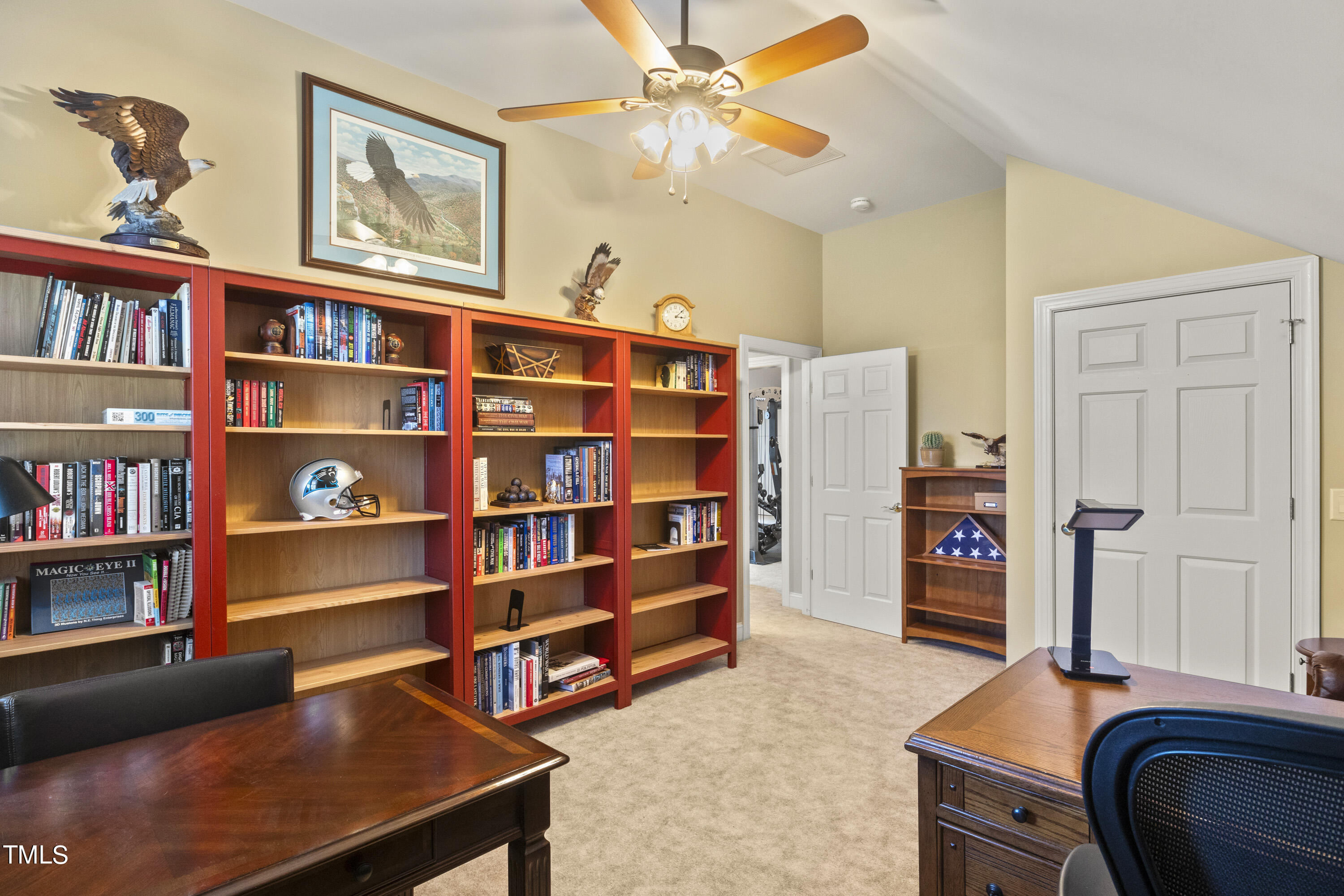 5504 Yates Mill Pond Road Raleigh, NC 27606 - Photo 38 of 56 a view of a workspace with furniture and book shelf