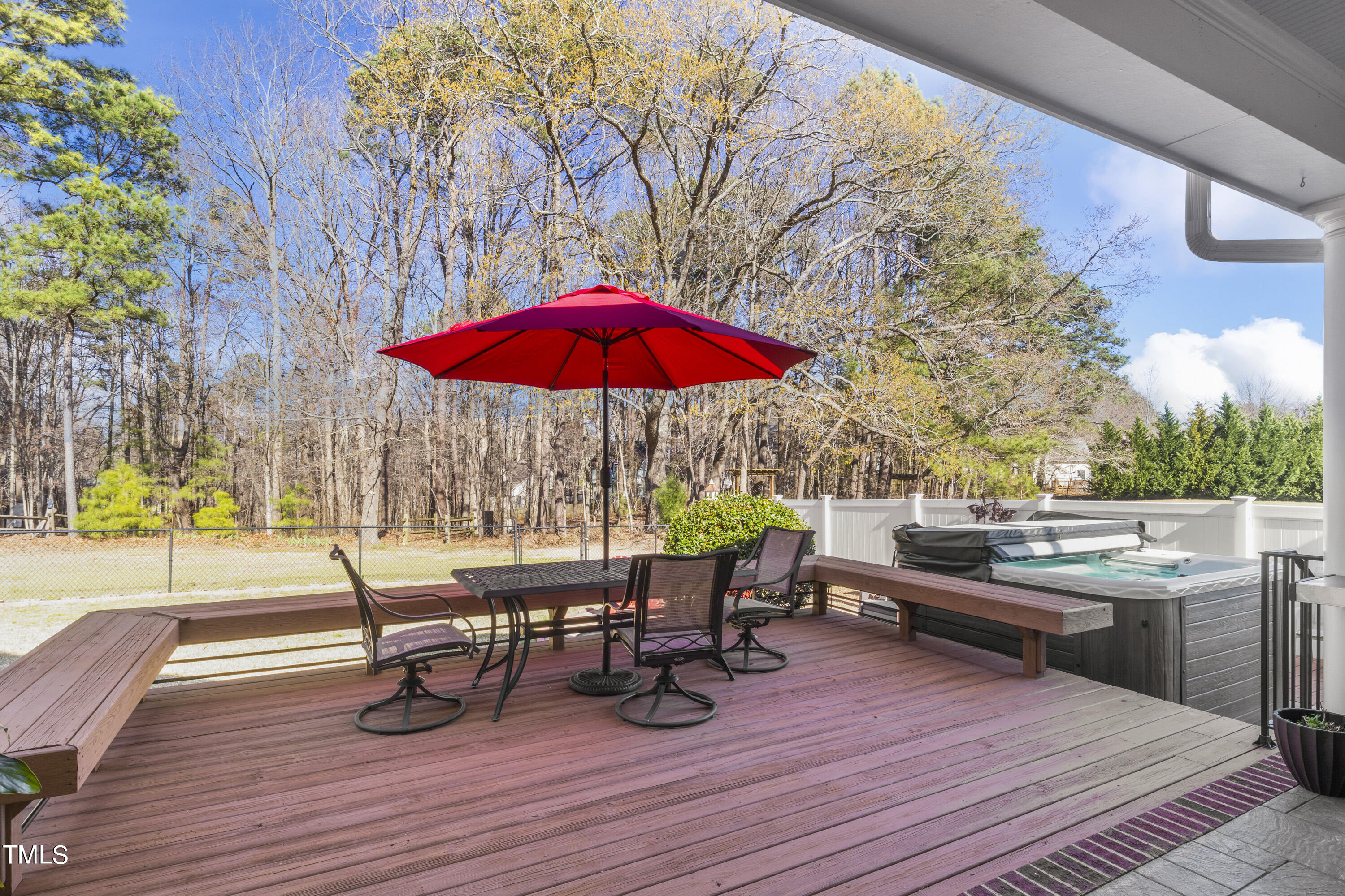 5504 Yates Mill Pond Road Raleigh, NC 27606 - Photo 39 of 56 a view of a rooftop deck with table and chairs
