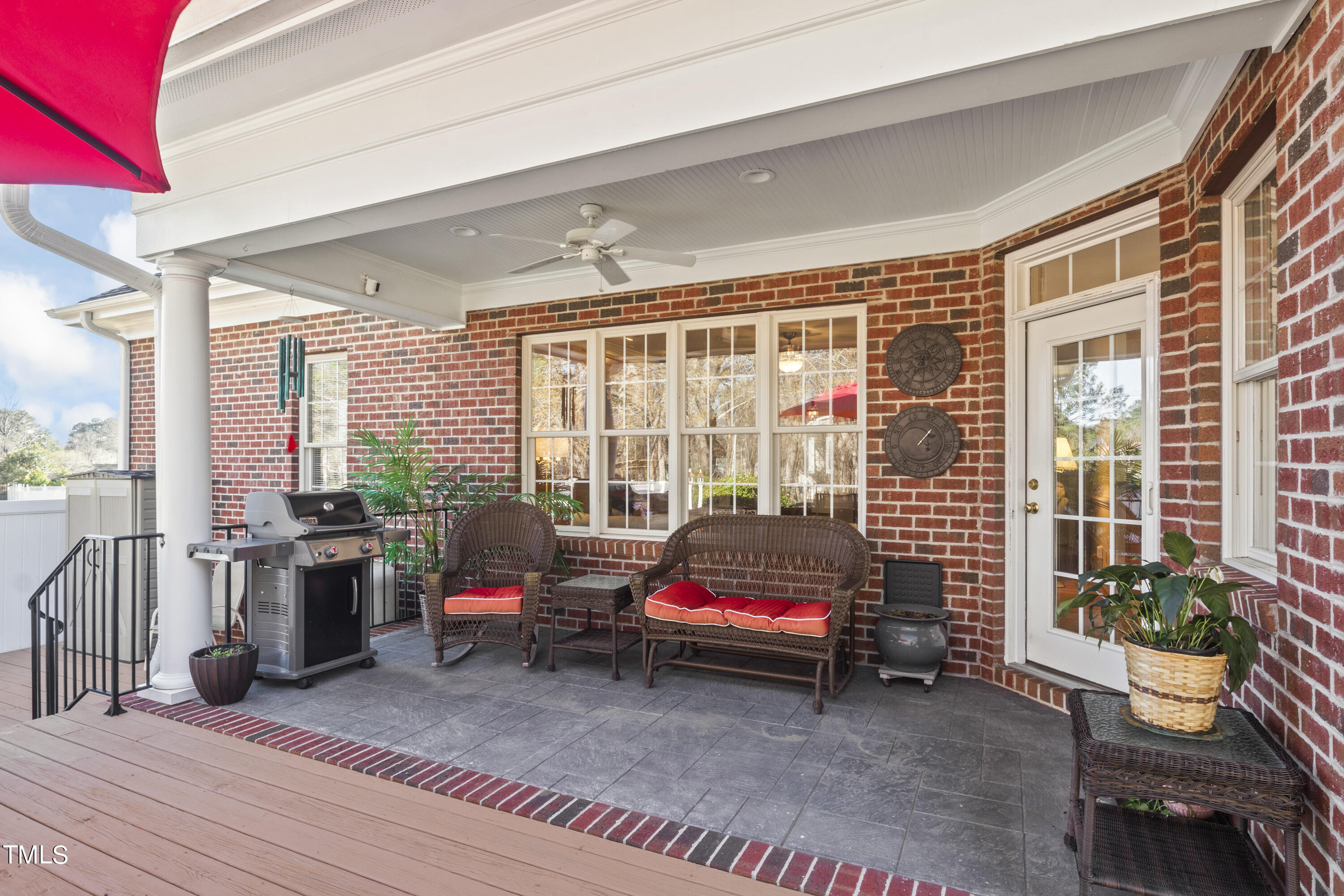 5504 Yates Mill Pond Road Raleigh, NC 27606 - Photo 40 of 56 a living room with furniture and floor to ceiling windows