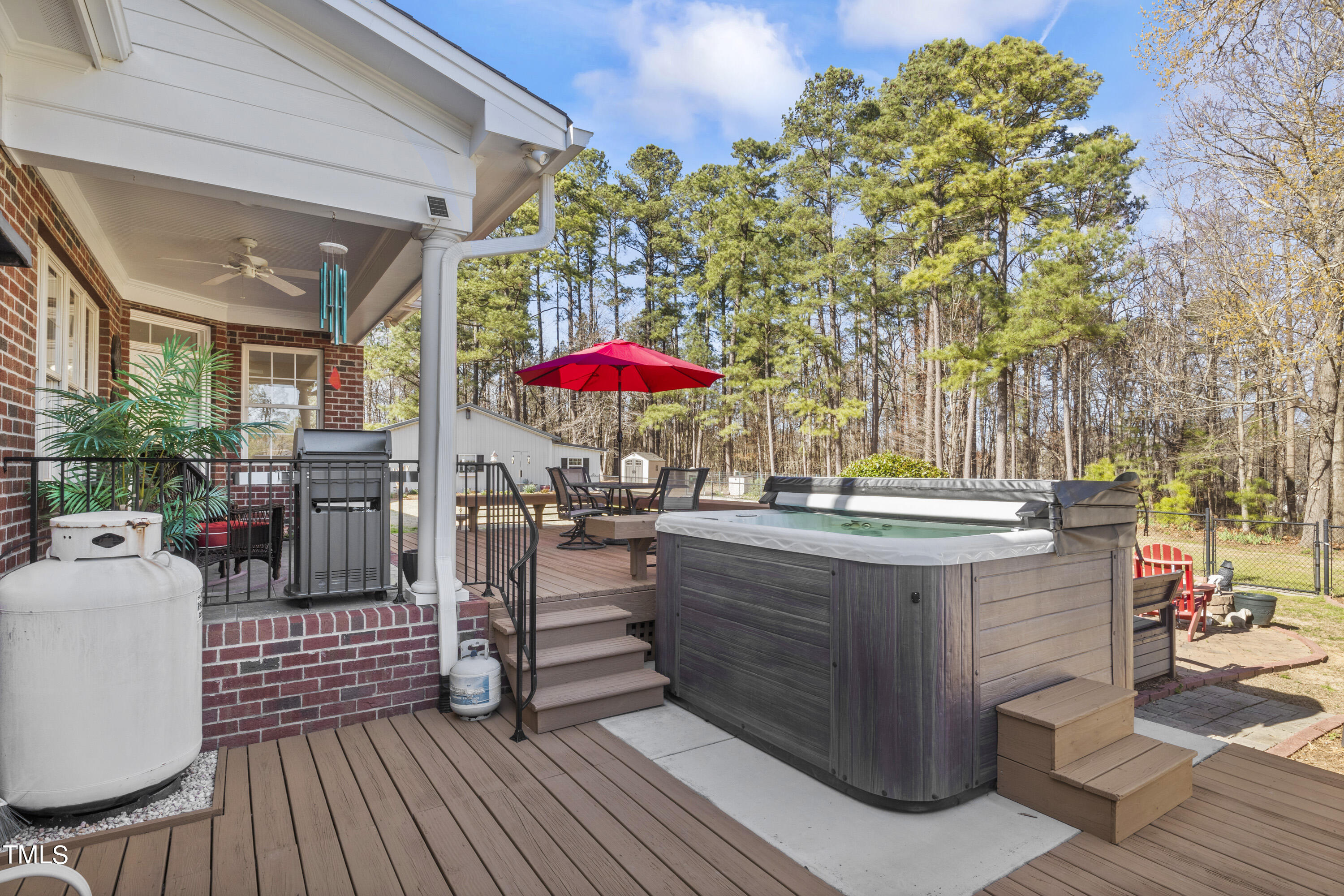 5504 Yates Mill Pond Road Raleigh, NC 27606 - Photo 41 of 56 a view of patio with a table and chairs