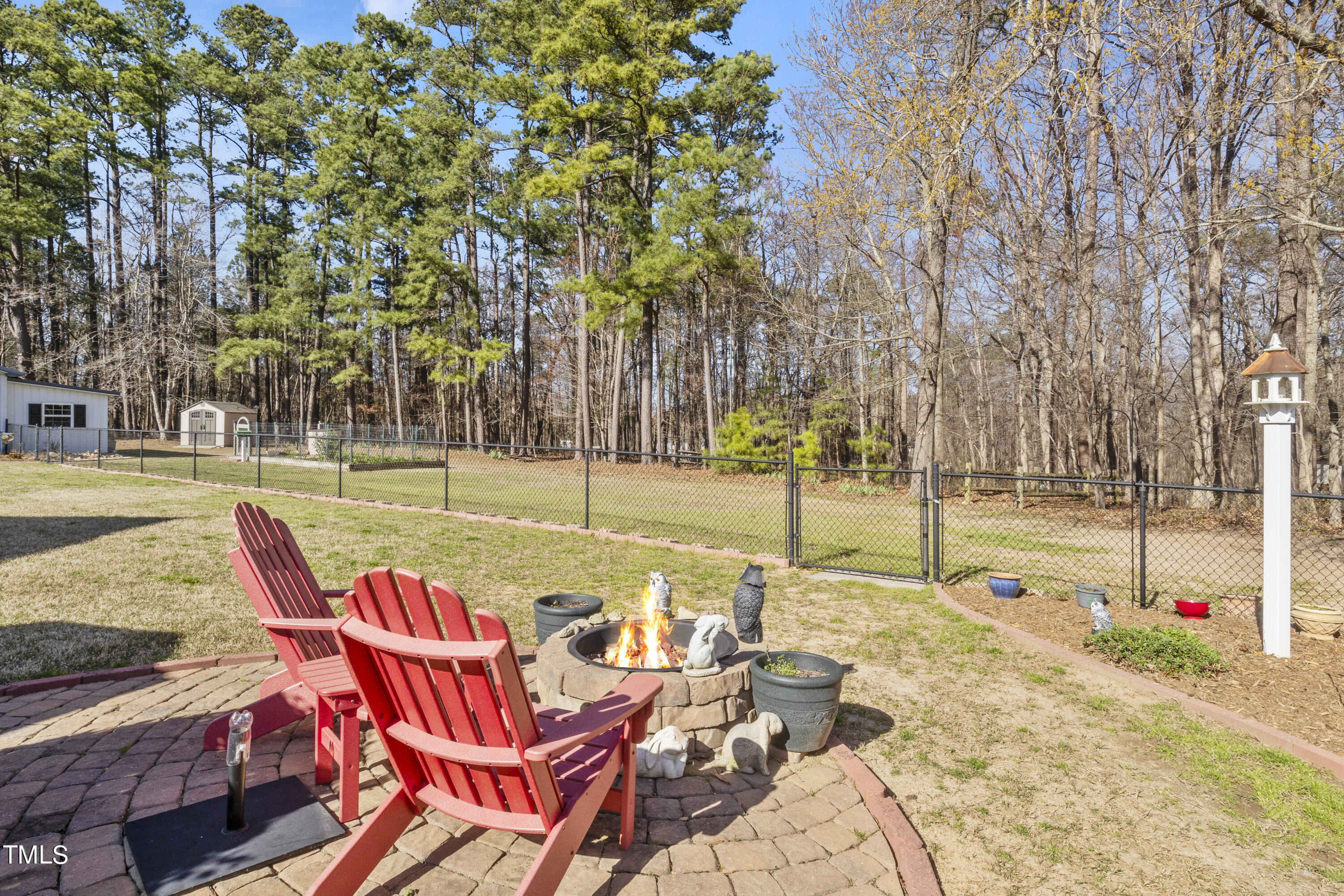 5504 Yates Mill Pond Road Raleigh, NC 27606 - Photo 42 of 56 a view of a swimming pool with a patio