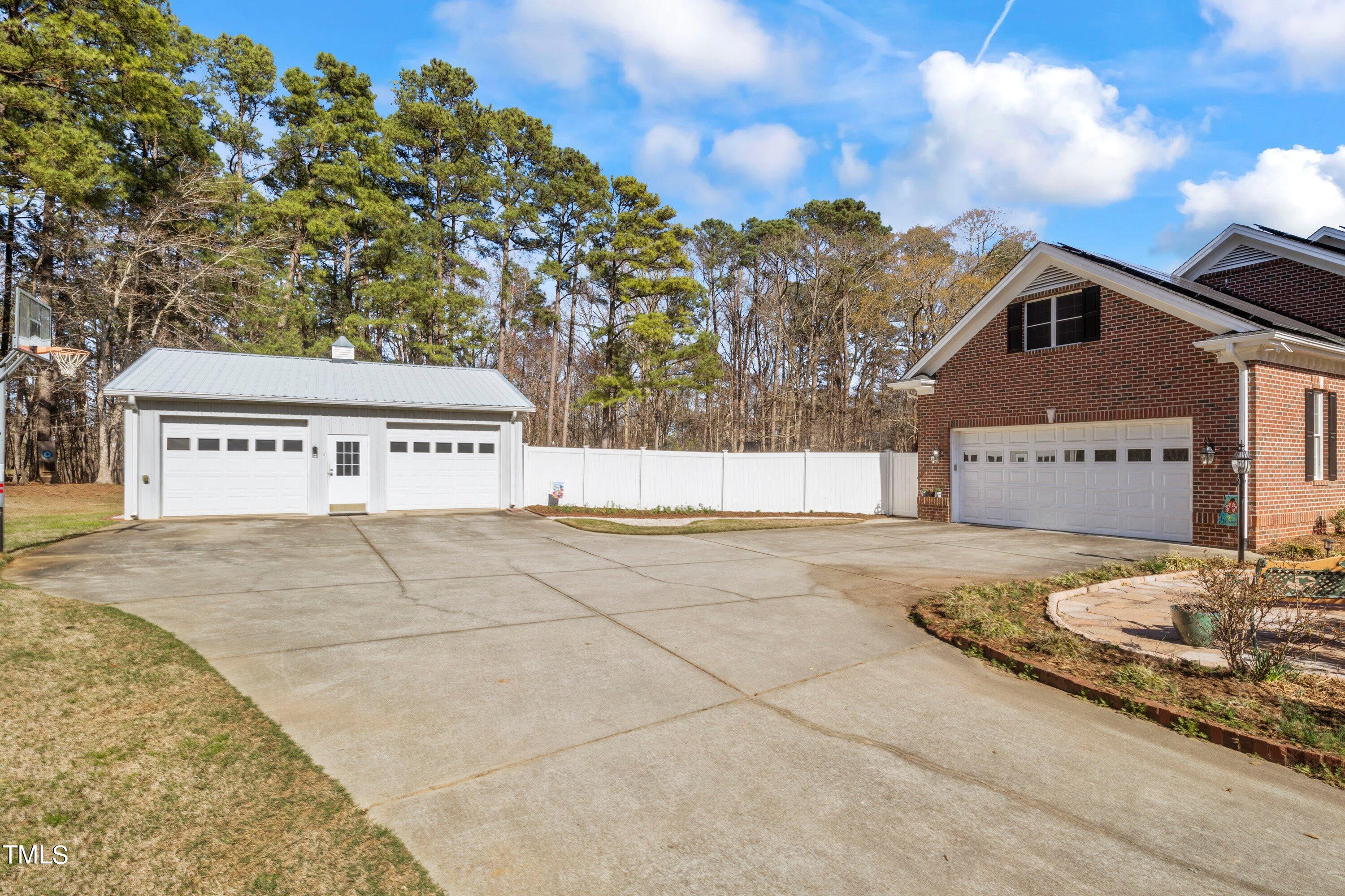 5504 Yates Mill Pond Road Raleigh, NC 27606 - Photo 52 of 56 a view of a house with a snow