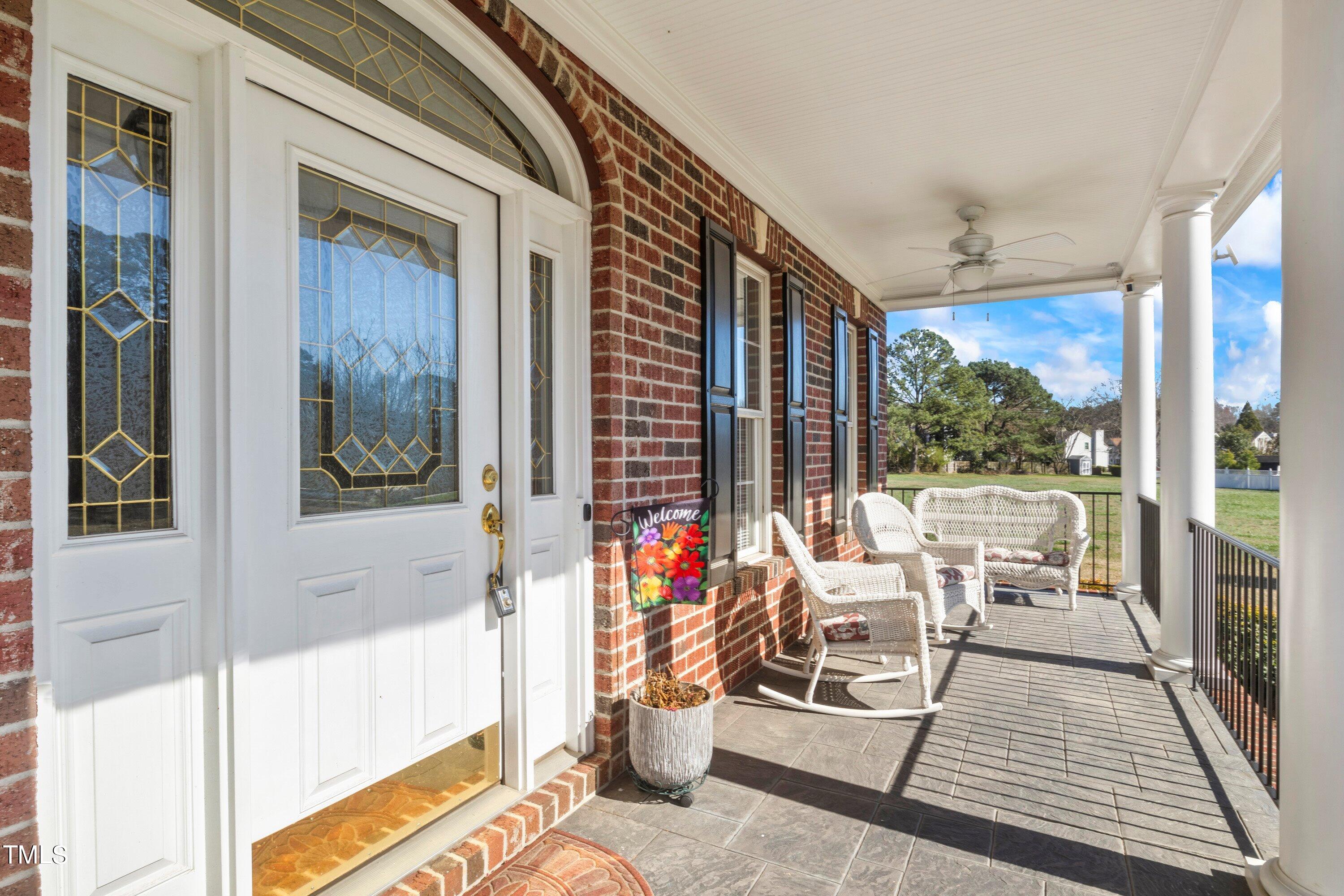 5504 Yates Mill Pond Road Raleigh, NC 27606 - Photo 6 of 56 a view of a balcony with wooden floor and outdoor space