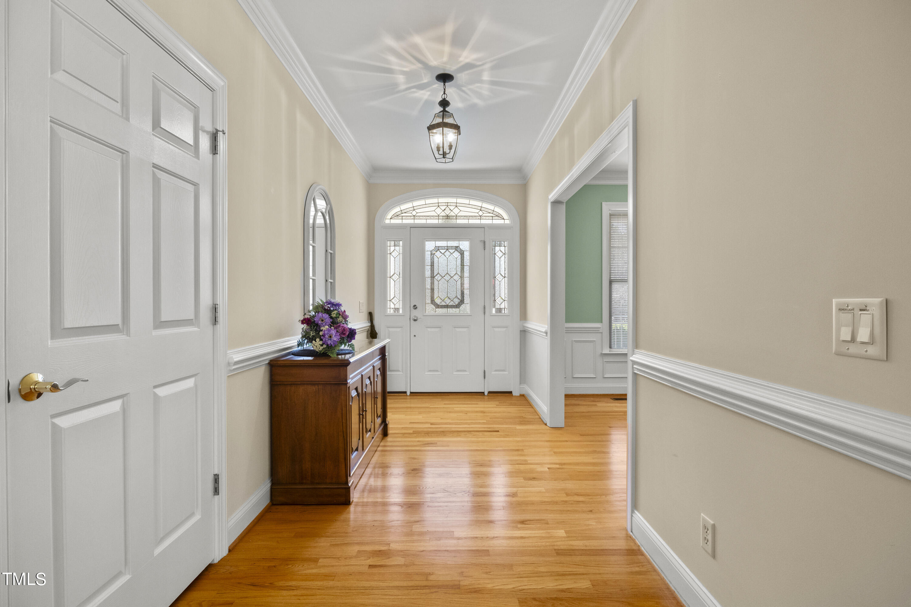 5504 Yates Mill Pond Road Raleigh, NC 27606 - Photo 7 of 56 a view of a hallway view with wooden floor and staircase
