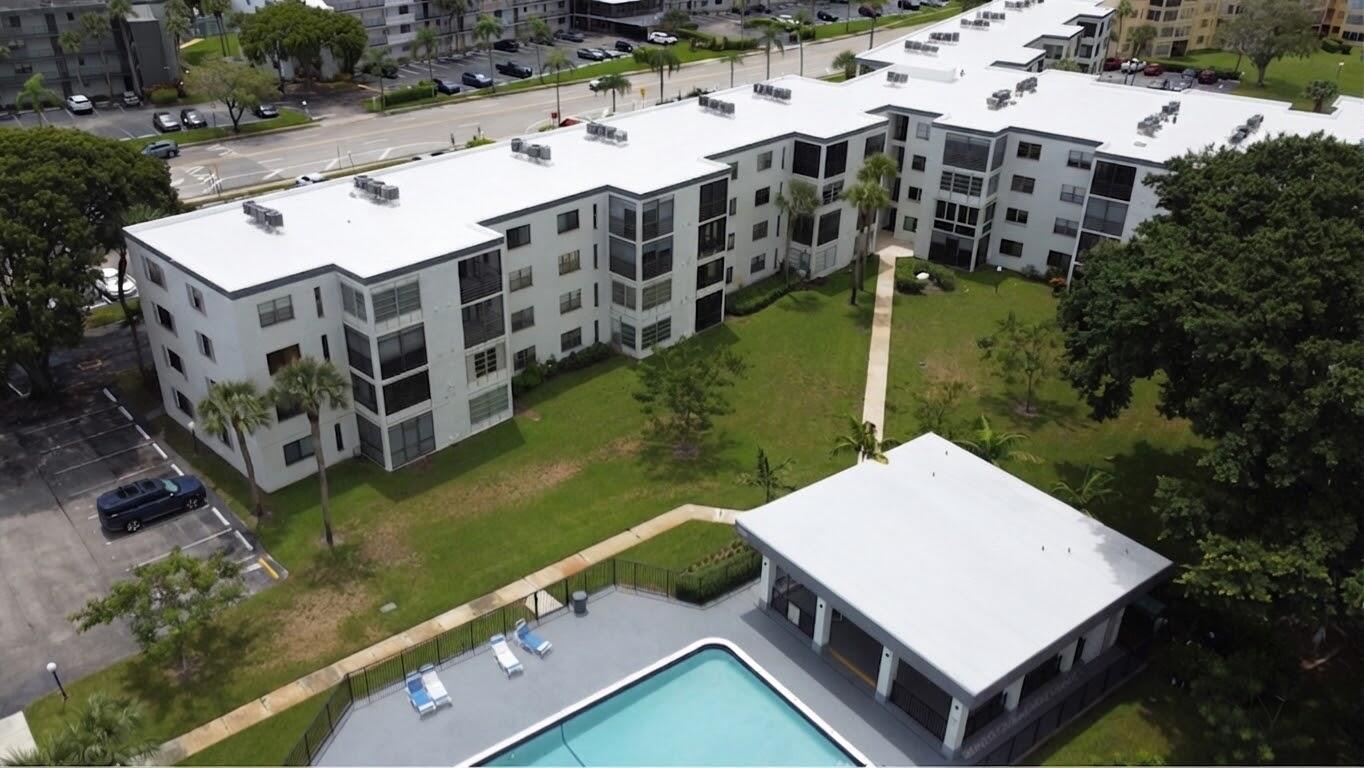 9233 Southwest 8th Street, Unit 218 Boca Raton, FL 33428 - Photo 2 of 22 White roof pool area