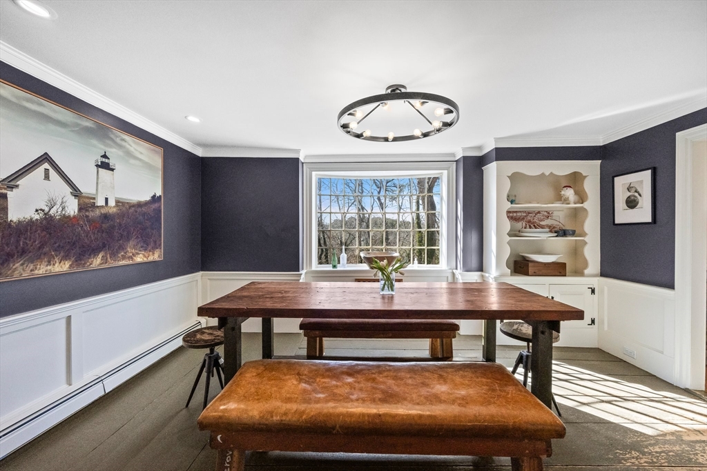 5 Depot Road Truro, MA 02666 - Photo 15 of 42 a view of a dining room with furniture wooden floor and window