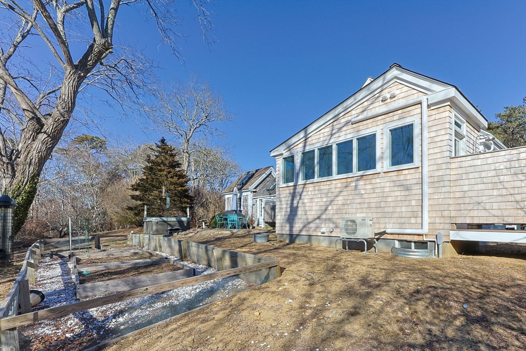 5 Depot Road Truro, MA 02666 - Photo 37 of 42 a front view of a house with a yard