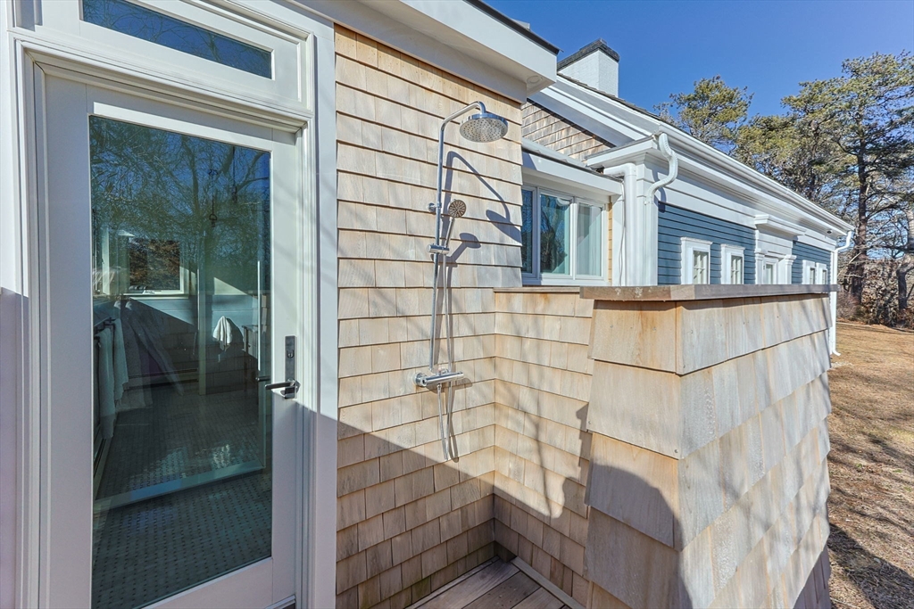 5 Depot Road Truro, MA 02666 - Photo 38 of 42 a bathroom with a shower and mirror