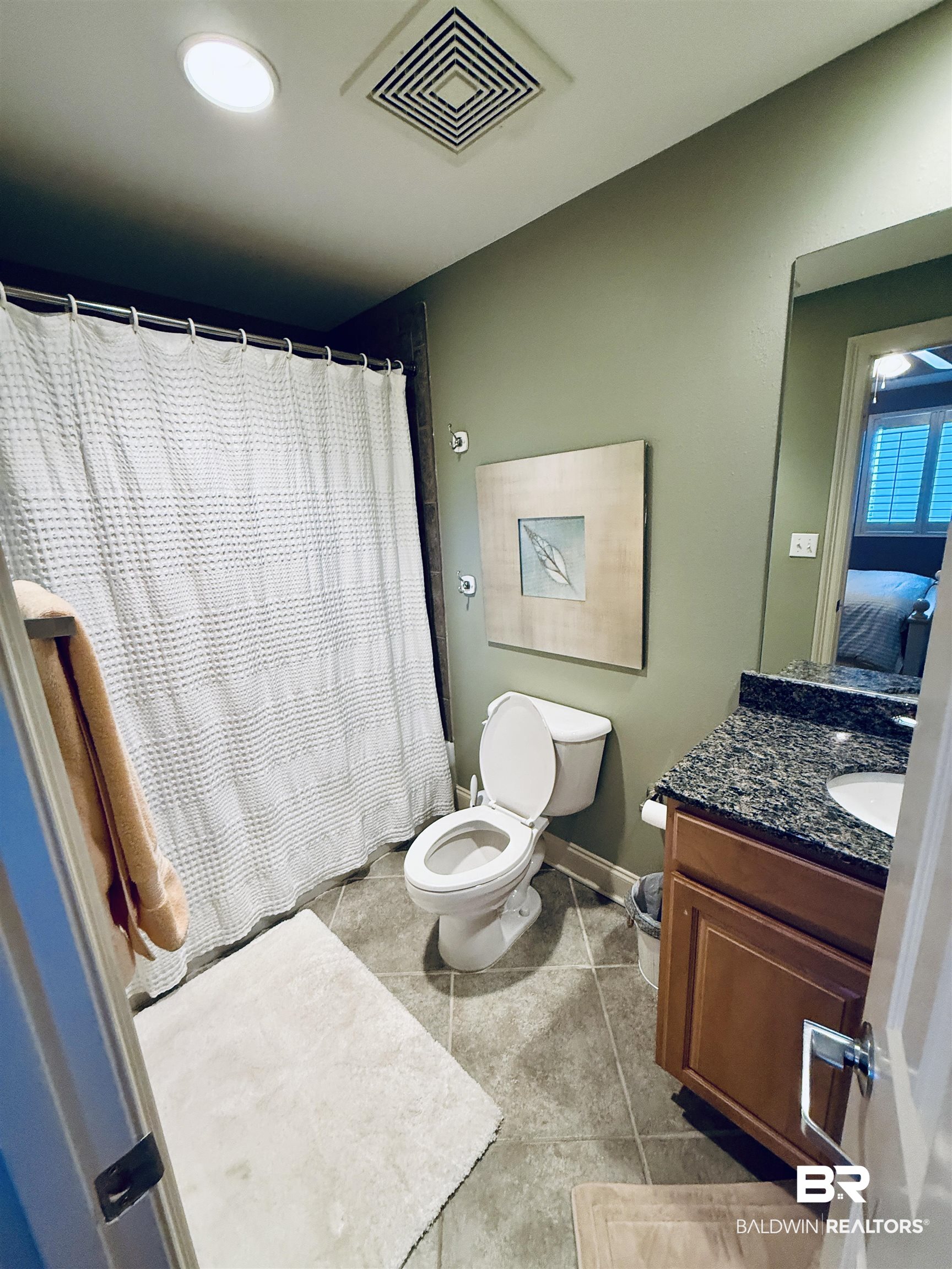 27800 Canal Road, Unit 409 Orange Beach, AL 36561 - Photo 8 of 22 Bathroom with vanity, a shower with curtain, and light tile patterned floors