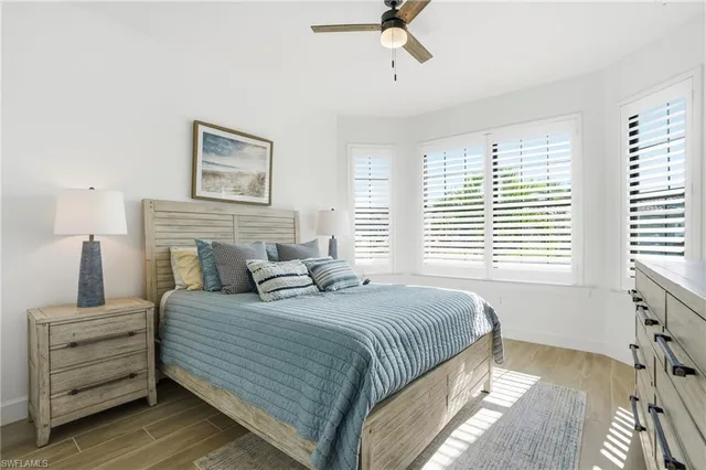 a bedroom with a bed and a night stand