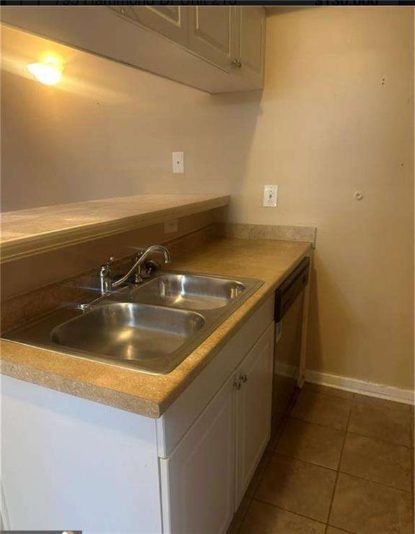 795 Hammond Drive, Unit 210 Atlanta, GA 30328 - Photo 15 of 18 a close view of sink and tap