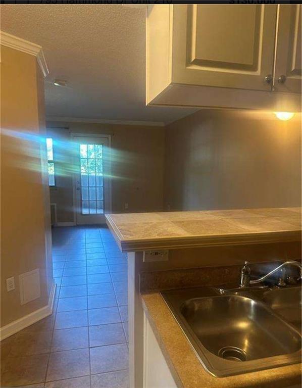 795 Hammond Drive, Unit 210 Atlanta, GA 30328 - Photo 16 of 18 a bathroom with a tub