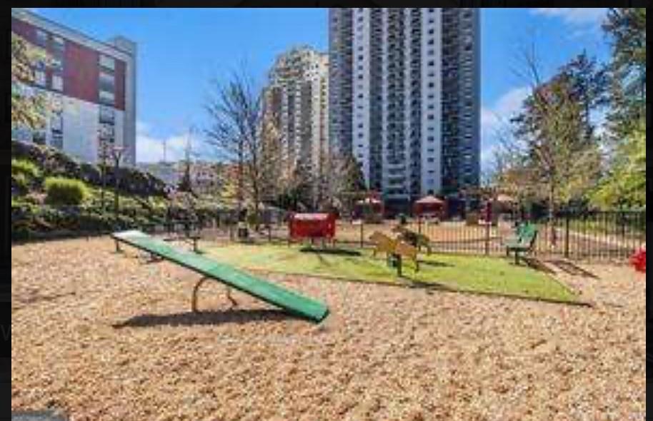 795 Hammond Drive, Unit 210 Atlanta, GA 30328 - Photo 18 of 18 a view of a park with swings and slides